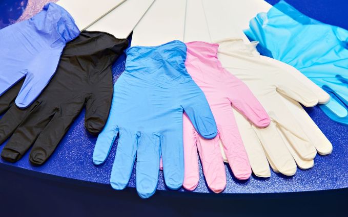 Assortment of nitrile gloves in various colors and thicknesses.
