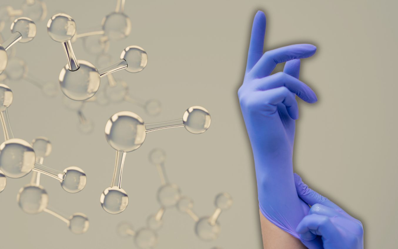 Person putting on blue nitrile gloves. Protection against various substances.