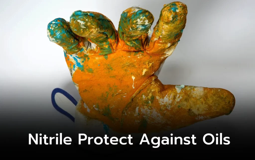 Paint-splattered nitrile glove demonstrating oil resistance.