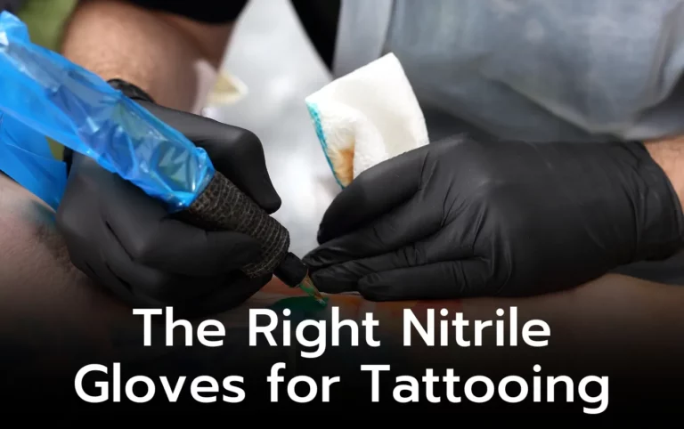 Close-up of a tattoo artist's hands wearing black nitrile gloves, using a tattoo machine. Selecting the right gloves is key.